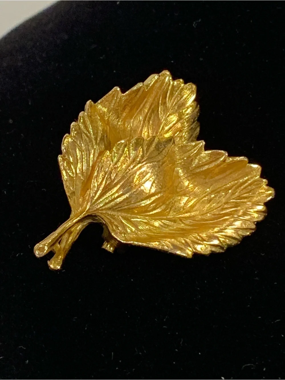 Beautiful vintage Marvella brooch in the shape of a curled leaf, done in brushed